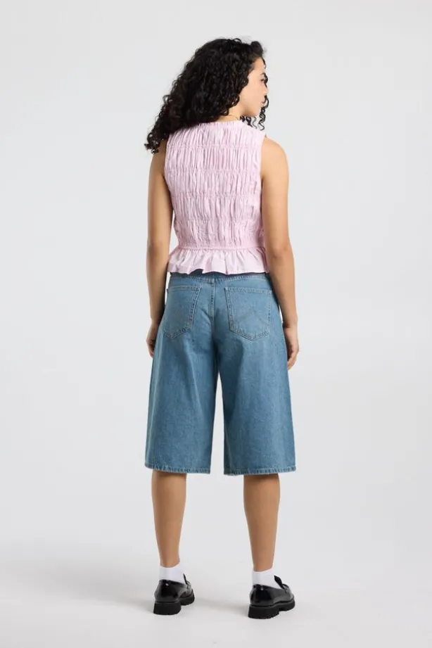 Top Ilka gesmockte haltertop met strikjes en ruffles