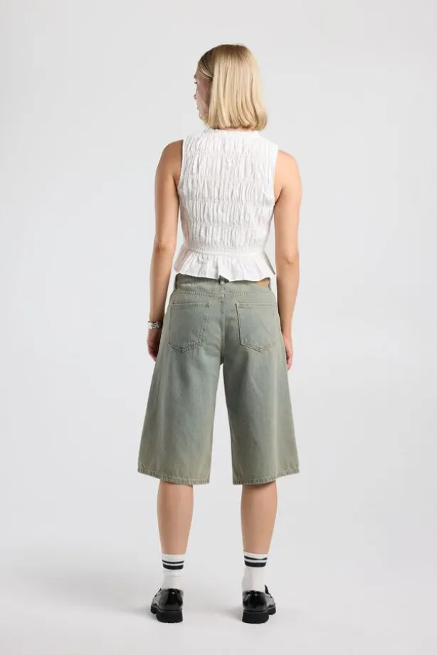 Top Ilka gesmockte haltertop met strikjes en ruffles